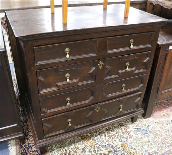 A Jacobean oak chest W.96cm